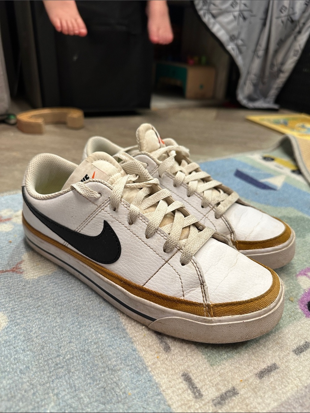 Nike Women’s White Sneakers with Black Swoosh and Brown Accent